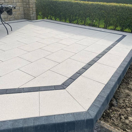 Newgrange Yellow Granite 600x400 patio with Damson smooth kerb border installed in Monaghan.