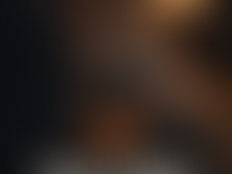 A man sits on the edge of his bed late at night reading a “Pray Now” message on his phone, illustrating how Christian brotherhood and fellowship are built through prayer and support between Sundays.