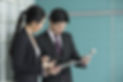 Chinese Business people reading electron