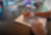 The hands of a resident colouring in a mandala as part of a therapy session