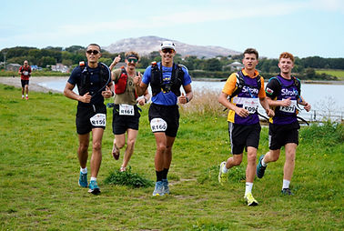 Photo: John Bowden - runners in the Anglesey Ring of Fire ultra-maration, sponsored by Scarlett's Fish & Chips