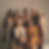 A group of multi-cultural women styled in luxury clothing.