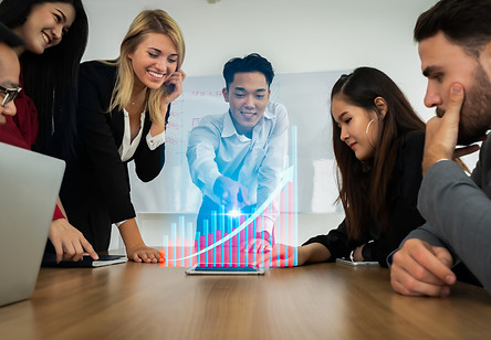 group-business-partners-meeting-present-with-modern-chart-hologram.jpg