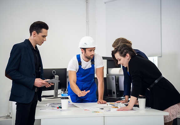 team-constructions-designers-meeting-with-engineer-office-discuss-current-project.jpg