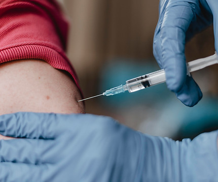 doctor-wearing-gloves-giving-child-vaccine.jpg