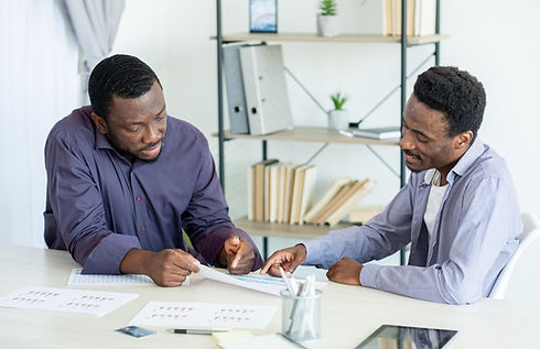 corporate-meeting-male-colleagues-team-work-smiling-men-sitting-workplace-discussing-docum