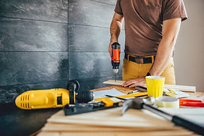 man-drilling-wood-with-battery-power-drill.jpg