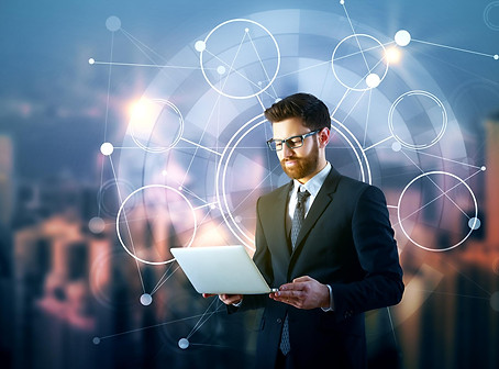 man-using-laptop-with-business-chart.jpg