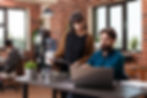 executive-managers-analyzing-papers-with-marketing-statistics-discussing-company-strategy-