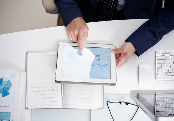 top-view-office-desktop-with-notebook-documents-computer-digital-tablet-used-by-anonymous-