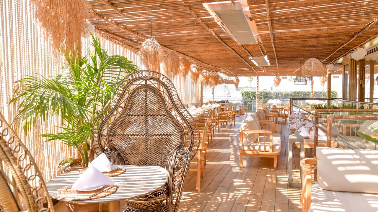 Outdoor of restaurant showinf various seating options