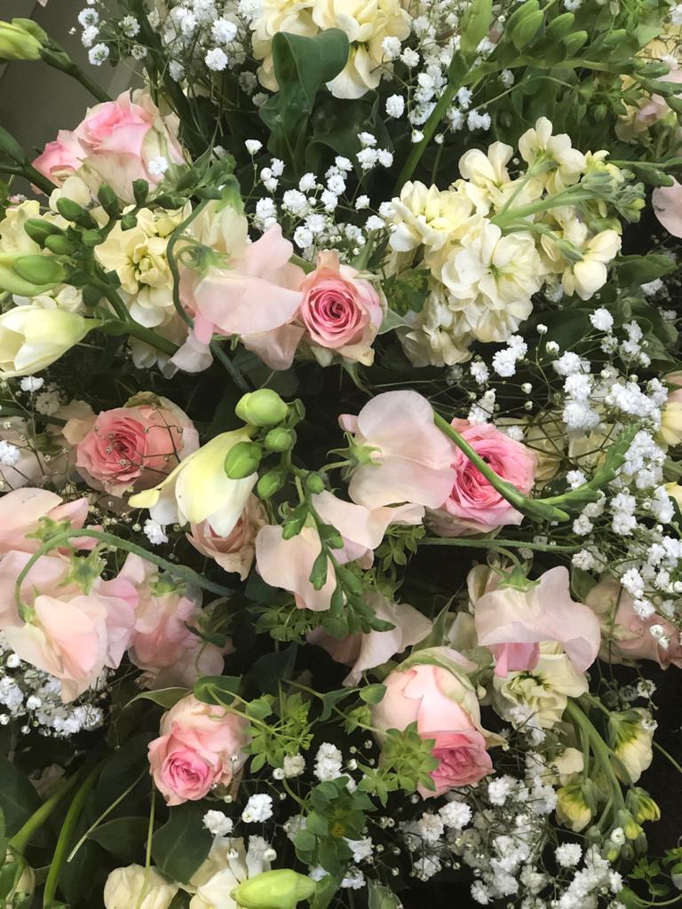 Coffin spray with Roses and Freesias