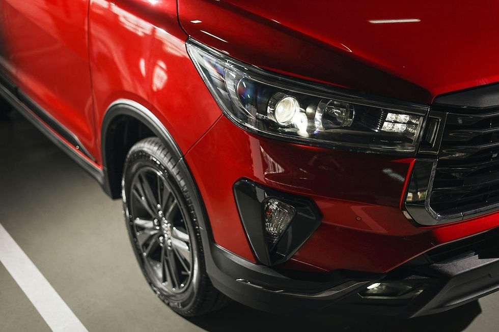 crimson-spark-red-metallic-toyota-innova-mpv-headlamp-corner-close-up-view