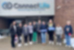 Teacher and students in front of the ConnectLife entrance.