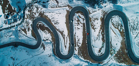 Aerial-view-of-red-car-on--Julier-pass-i