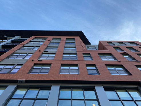 orange brick clads this multi-level modern building.