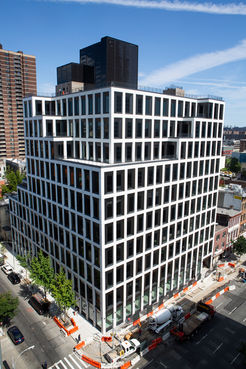 white glazed residential building clad glazed white in Corium brick. 