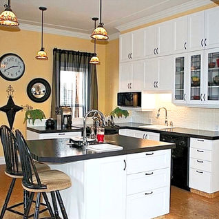 Kitchen renovation in a heritage home featuring updated cabinets and countertops