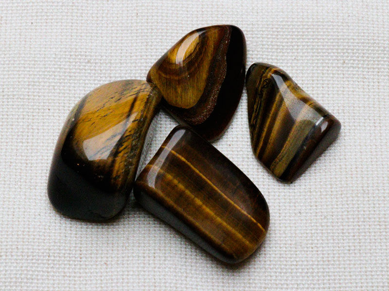 Gold Tiger’s Eye Tumblestones - 50gm with blue velvet pouch
