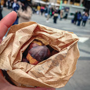 roasted chestnuts in paper bag in milan