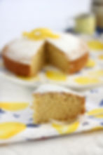 a slice of olive oil lemon cake simply garnished with icing sugar