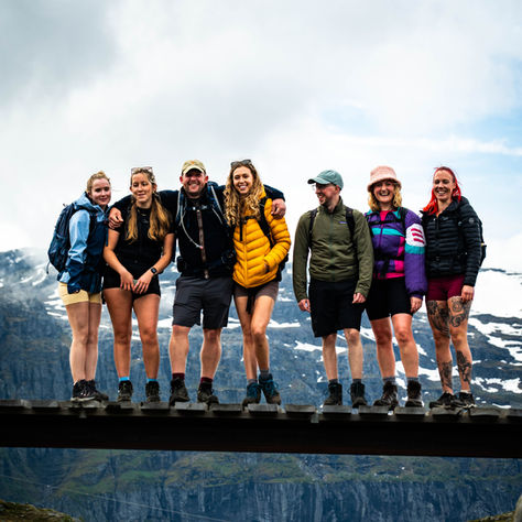 Group of hikers standing on a bridge in Norway