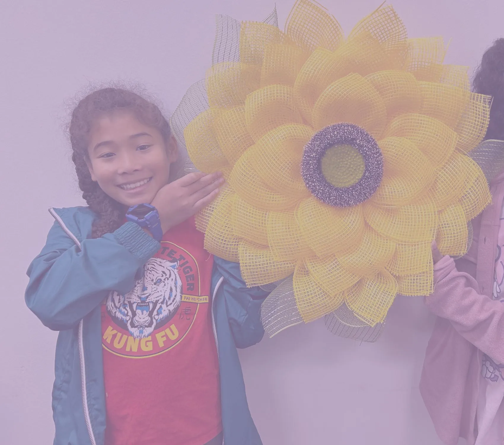 hispanic girl with sunflower.webp