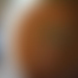 Carbonnade Flamande stew in a white pot with tender beef chunks and garnished with fresh thyme. The rich, brown sauce creates a hearty and warming feel.