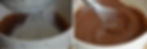 Chocolate Brownies: Left: Flour being sifted into chocolate batter in a white bowl Right: A thick chocolate batter in a white bowl being stirred with a whisk, creating a smooth and rich texture.
