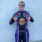 Atley holding two thumbs up