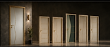 Porte Morgana bianche e verde scuro con decorazioni dorate geometriche e curve.