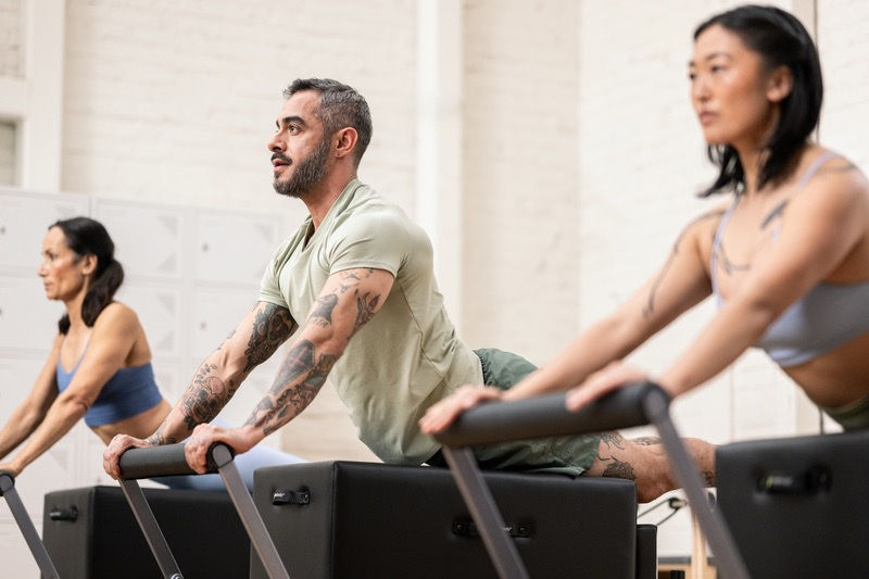 group fitness class on Balanced Body reformers