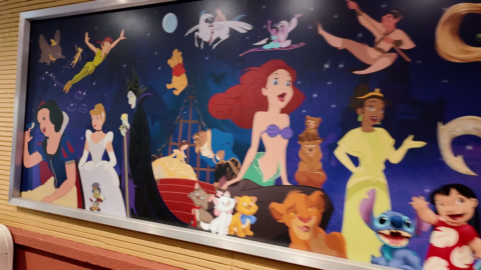 A large character mural inside the building.