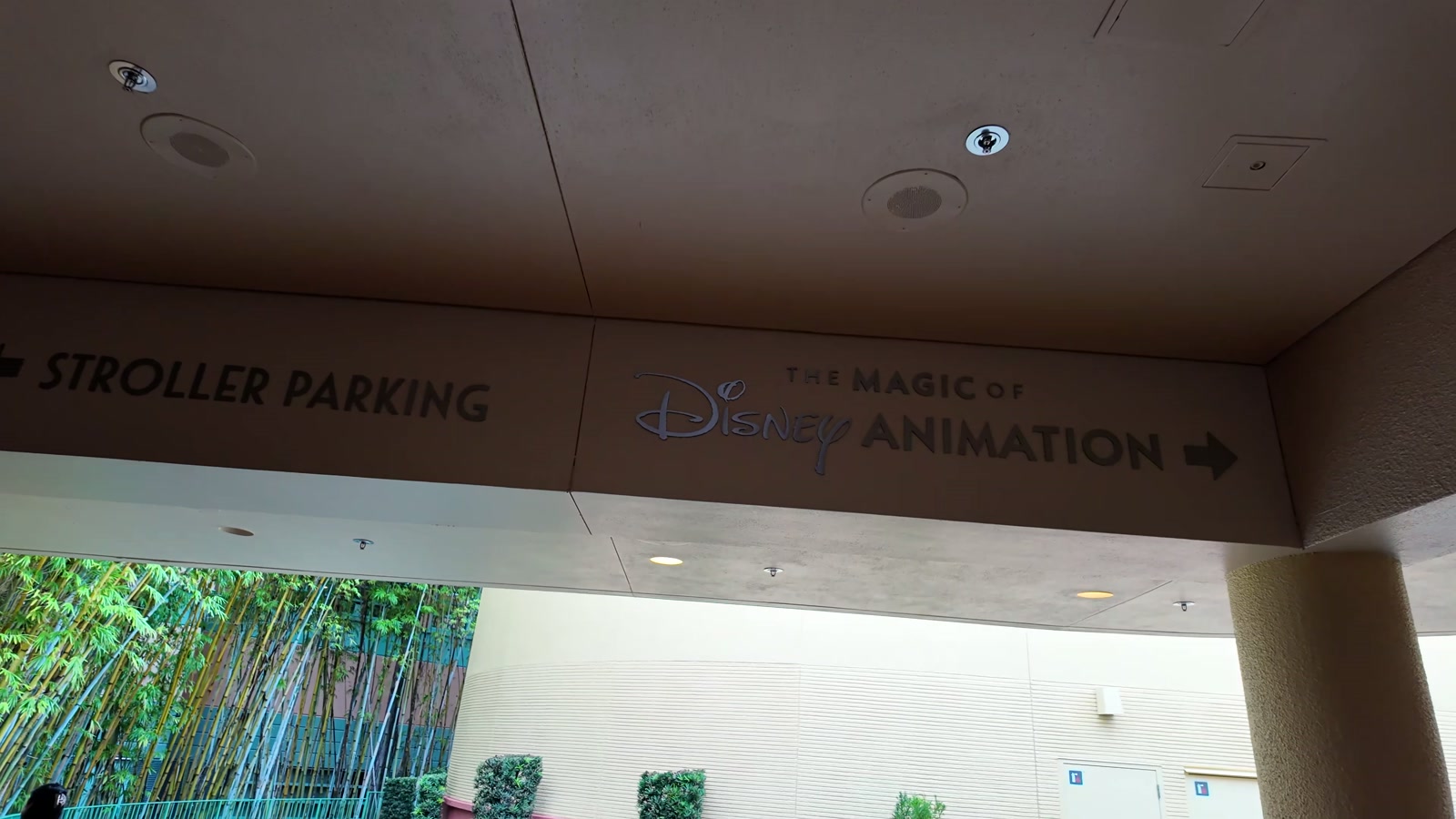 A sign pointing to stroller parking and The Magic of Disney Animation.