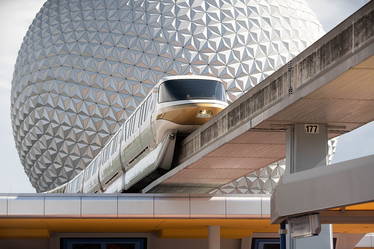 Spaceship Earth at EPCOT with a monorail passing