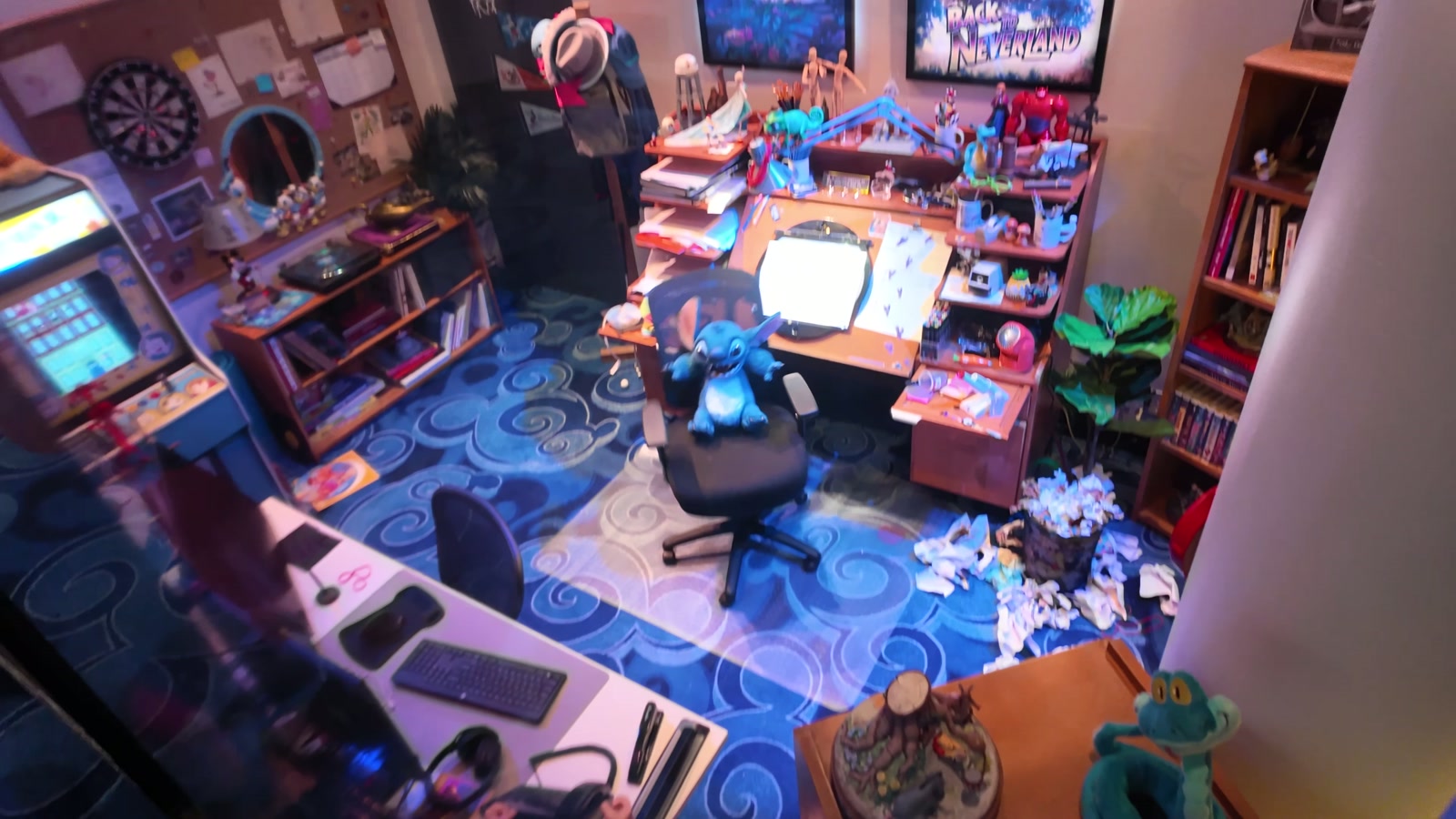 A decorated animator's desk behind glass.
