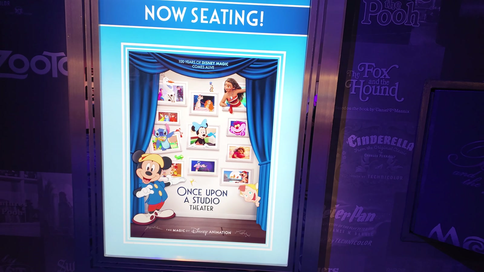 A Now Seating sign for the Once Upon a Studio Theater.