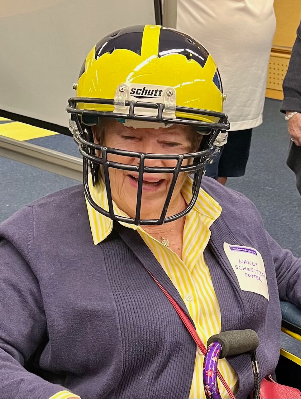 Nancy Schweitzer Potter trying on a helmet
