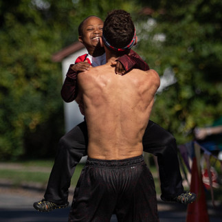 Boy with a disability smiling after participating with myTEAM TRIUMPH