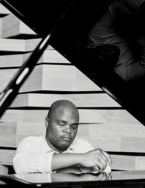 Mnana Website Resting on The Piano_edited.jpg