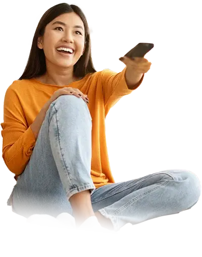 girl watching tv in hotel room