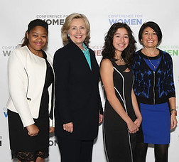Janet Ferone with students and Hillary Clinton