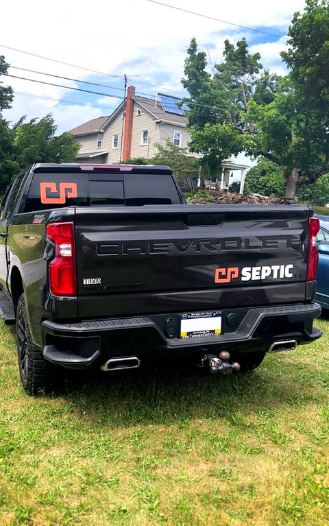 The septic company truck with its new logo design.