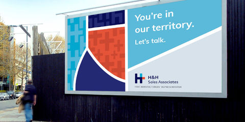 A billboard of the logo and brand design of how the brand pattern and brand colors work together.