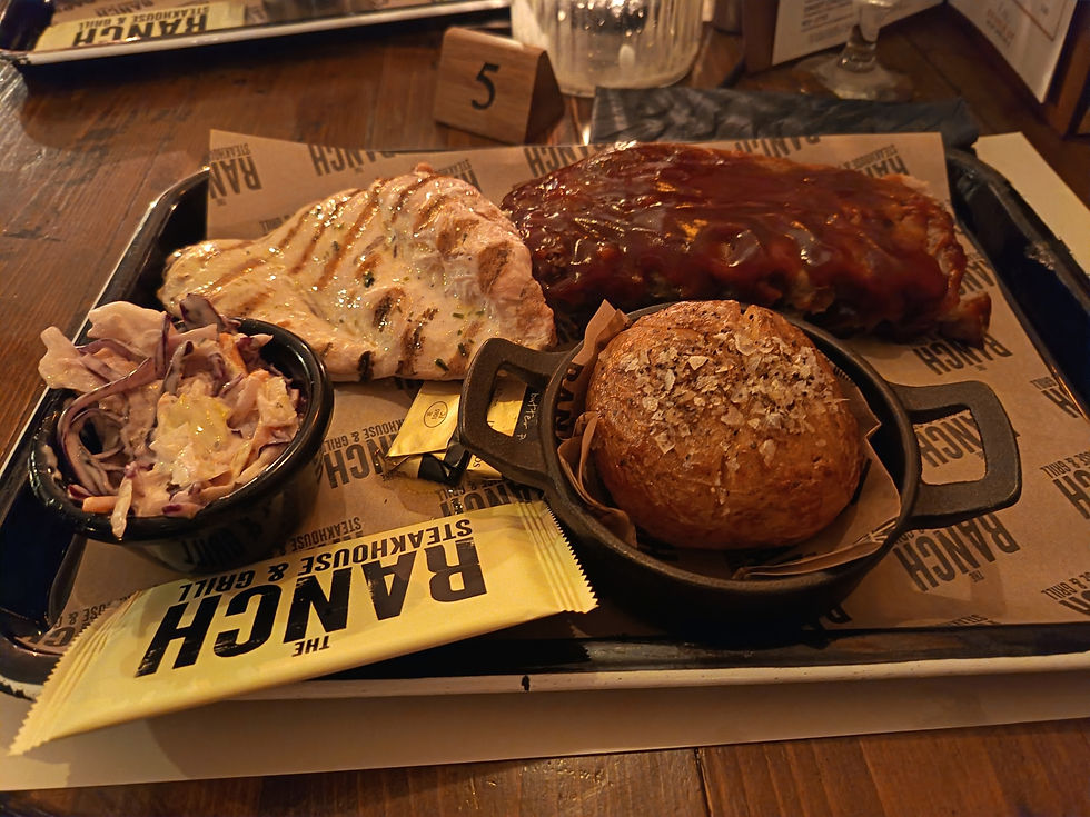 Ribs Combo (Half Rack with BBQ sauce) and Chicken Breast with Garlic and Herb seasoning. Served with slaw and Jacket Potato