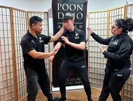 Advanced students being shown form techniques lead by Sifu Ko.