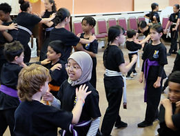 Intermediate students practising self defence on each other.