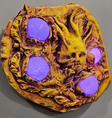 Acrylic paint, goatskin, foam clay, acrylic globes, glow- in- the dark stones and paint, battery operated lights.
9.5" x 8.5" x 2.5"