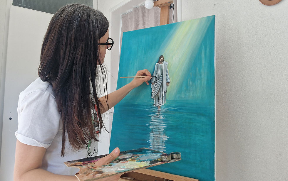 Artist painting Jesus walking on water, using a palette and brush. The artwork features blue tones with rays of light, conveying serenity.