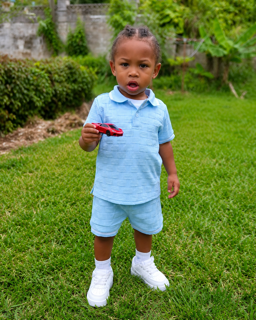 Toddler in blue outfit, part of JLS Little Legends.